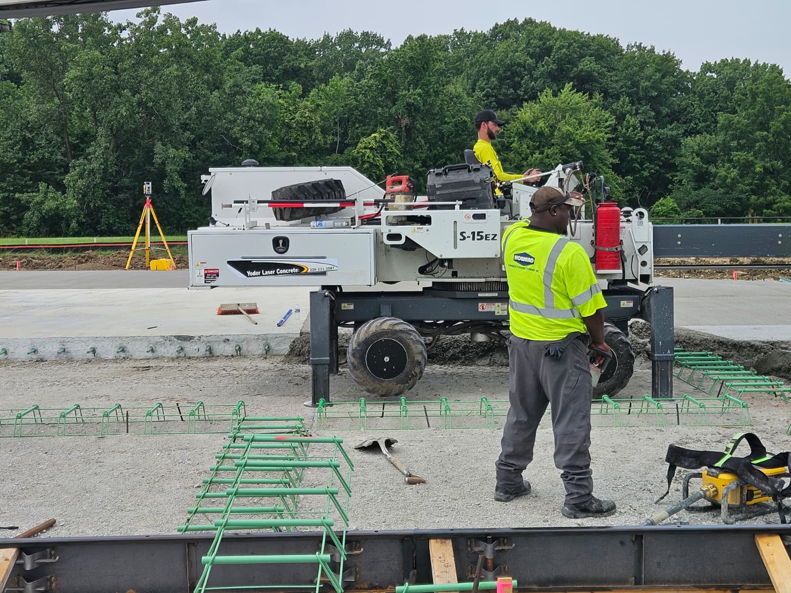 Somero S-15EZ operator and ground crew beside slab reinforcement