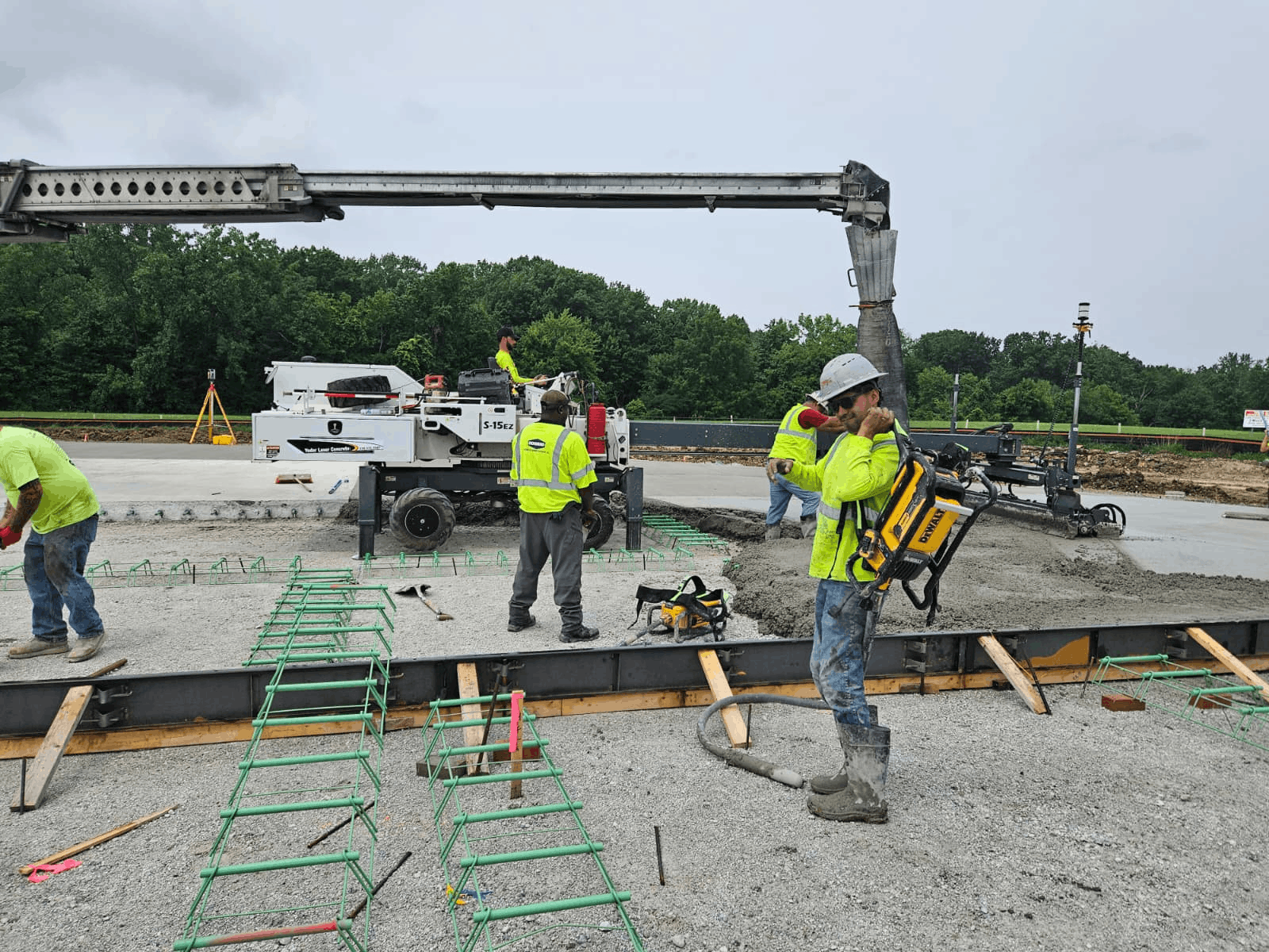 Yoder crew coordinating around a Somero S-15EZ and slab reinforcement