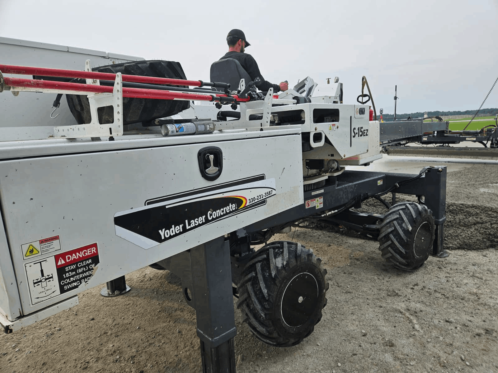 Close-up of Yoder Laser Concrete&rsquo;s Somero S-15EZ on an airfield slab