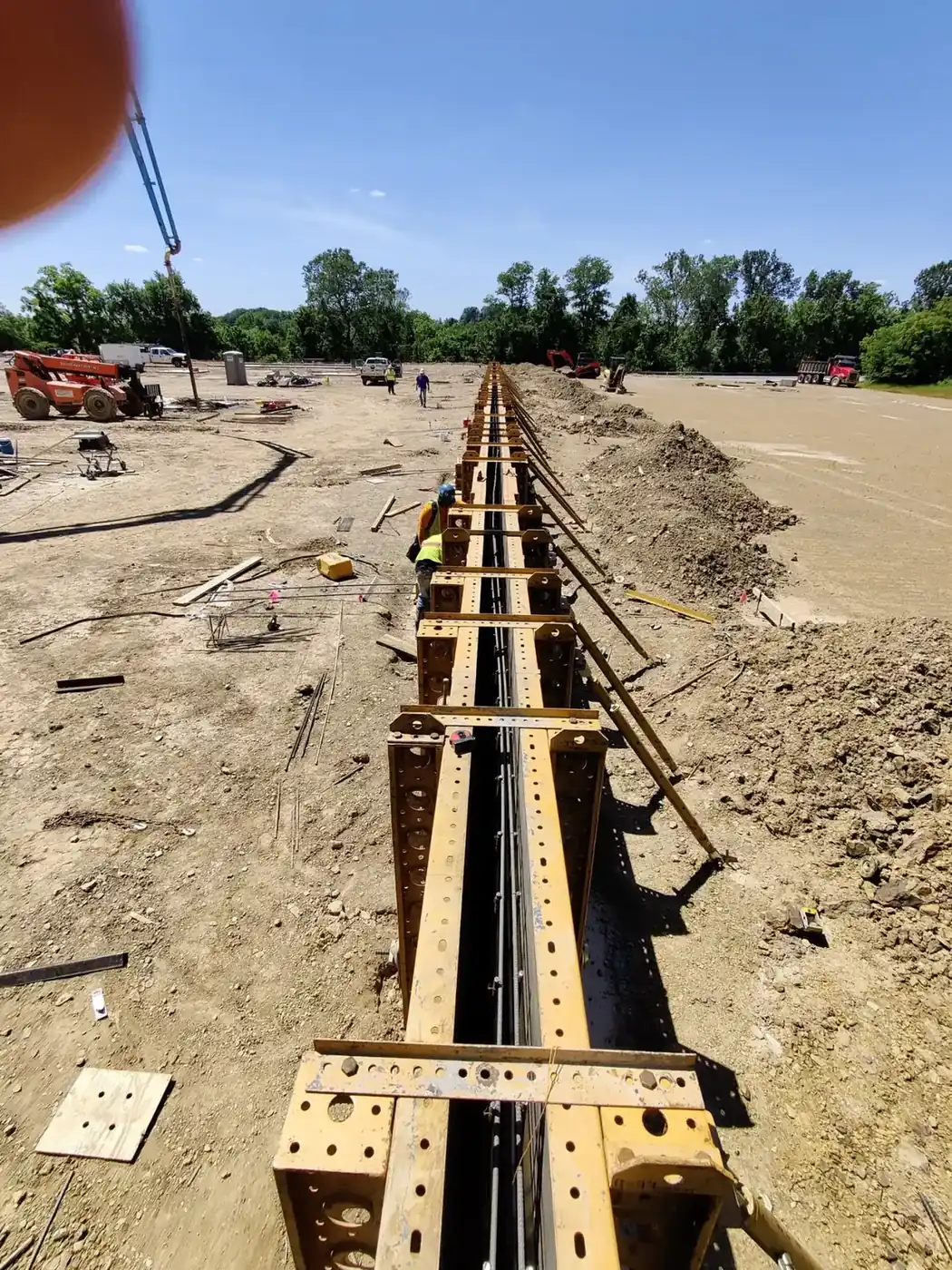 Steel wall formwork braced along a foundation trench on an Ohio commercial site