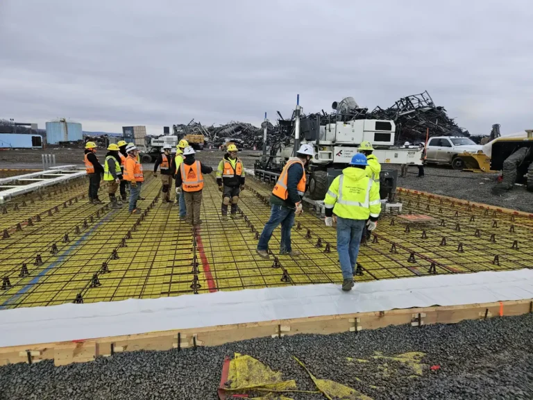 Crew checking the rebar mat before a laser screed slab pour