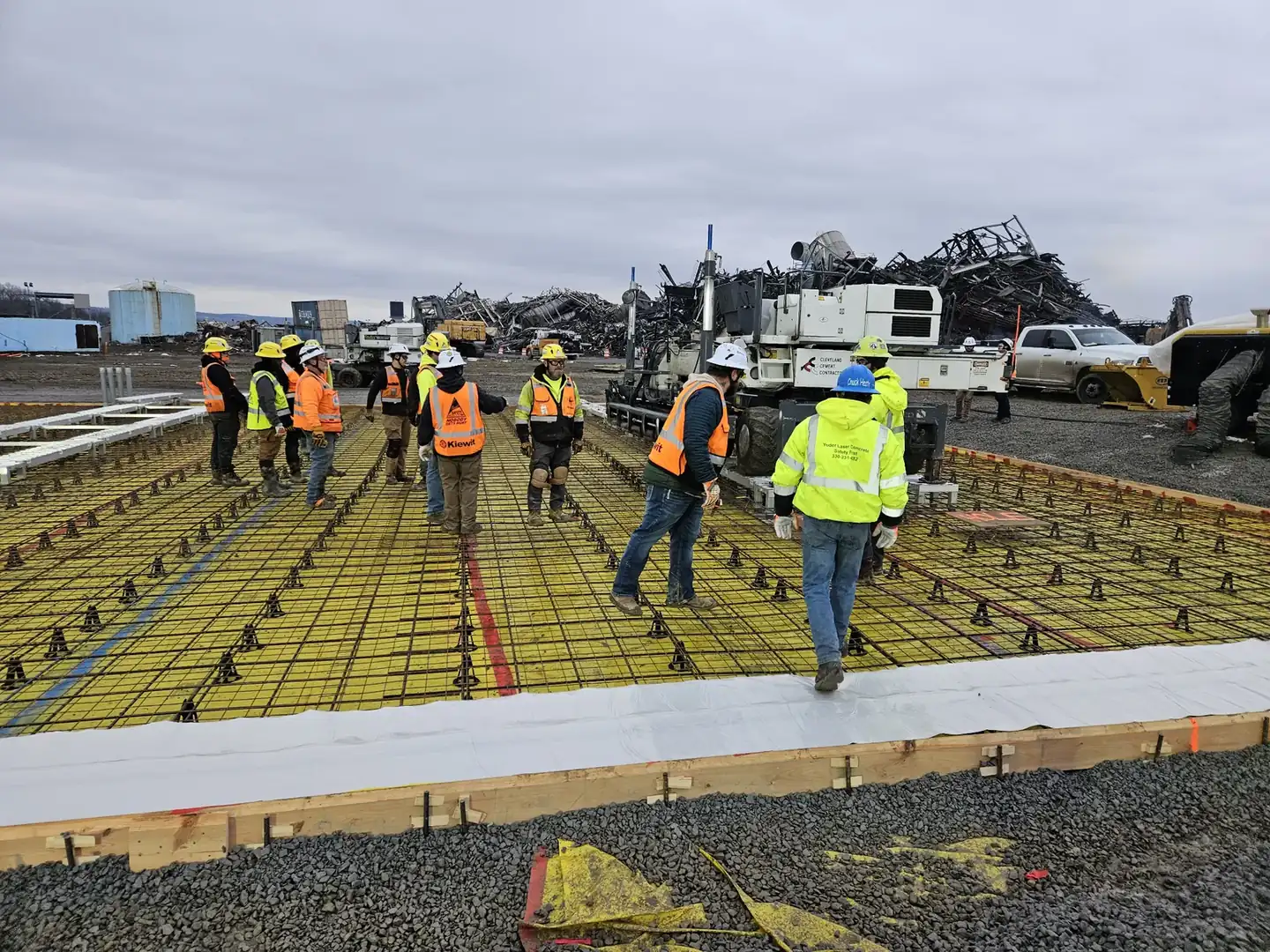 Reinforcing steel and chairs set across a commercial slab before the pour