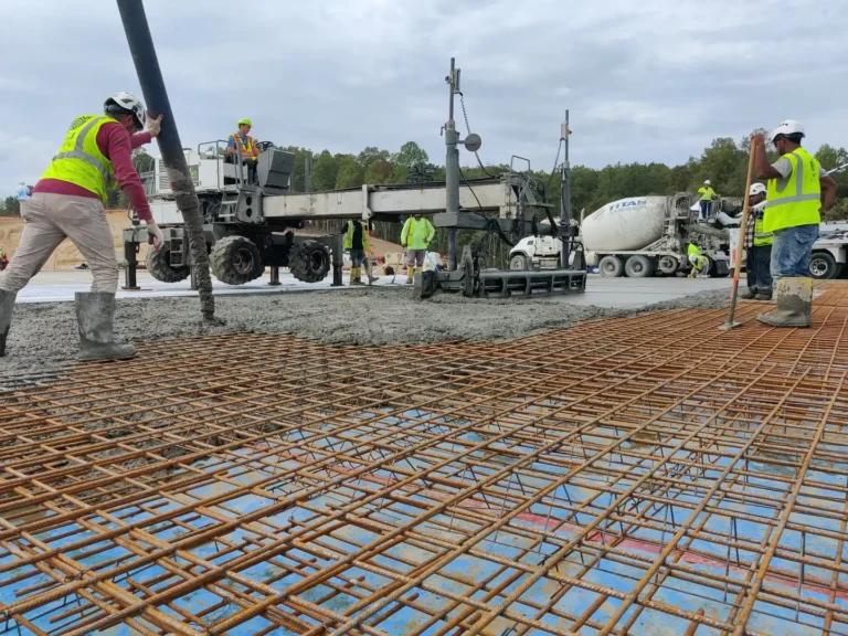 Laser screed and ready-mix trucks on a reinforced commercial slab pour