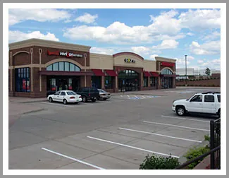 Finished commercial concrete parking lot with painted striping at an Ohio retail plaza