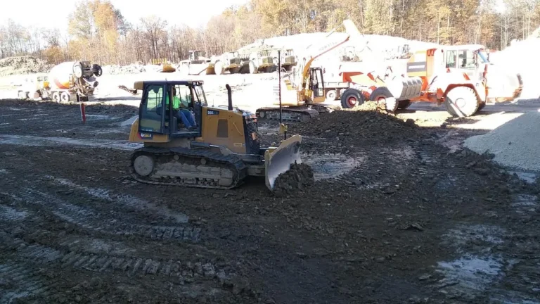 Dozer working subgrade on a commercial site ahead of concrete placement
