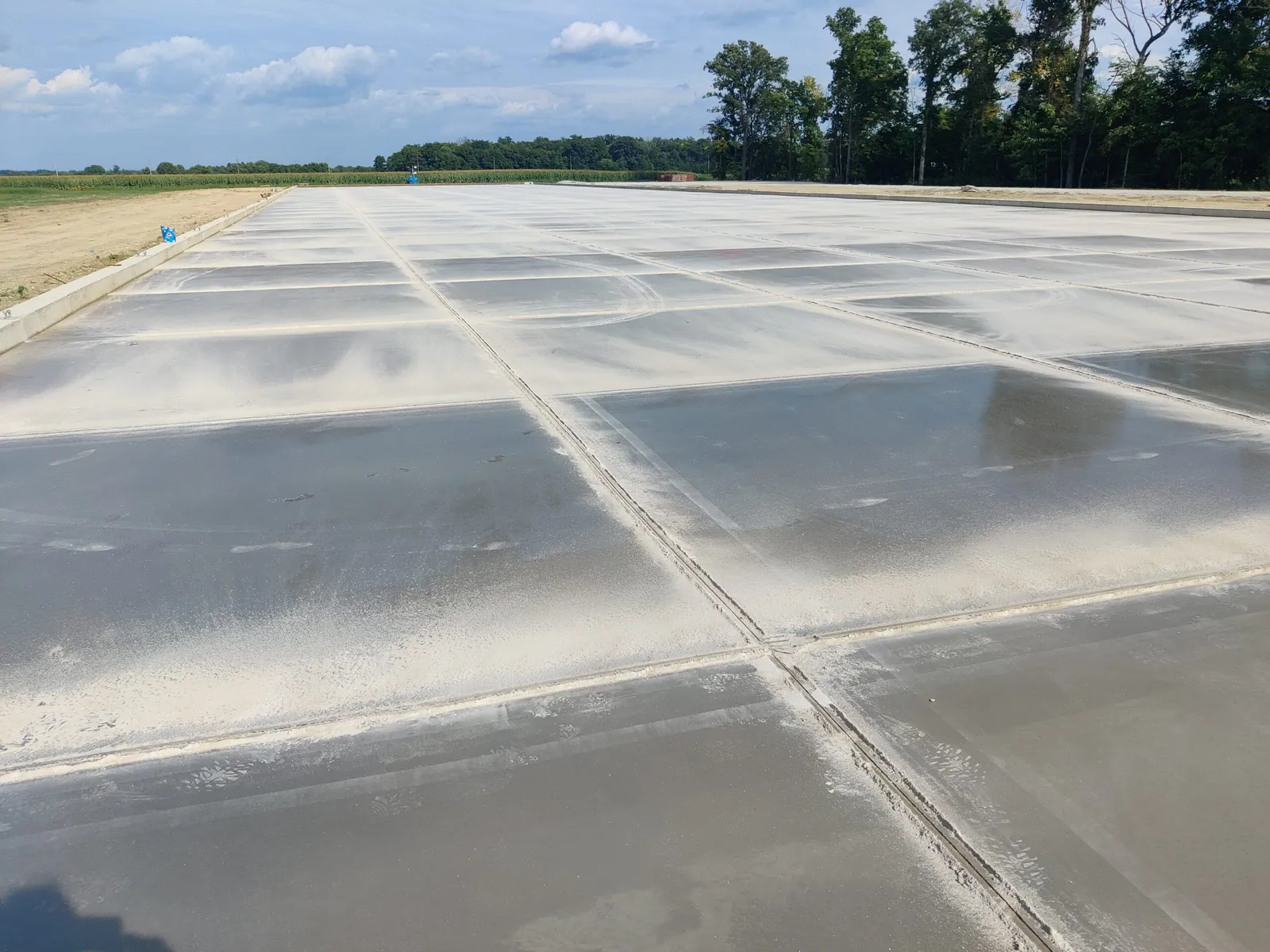 Finished commercial concrete slab showing the saw-cut joint pattern