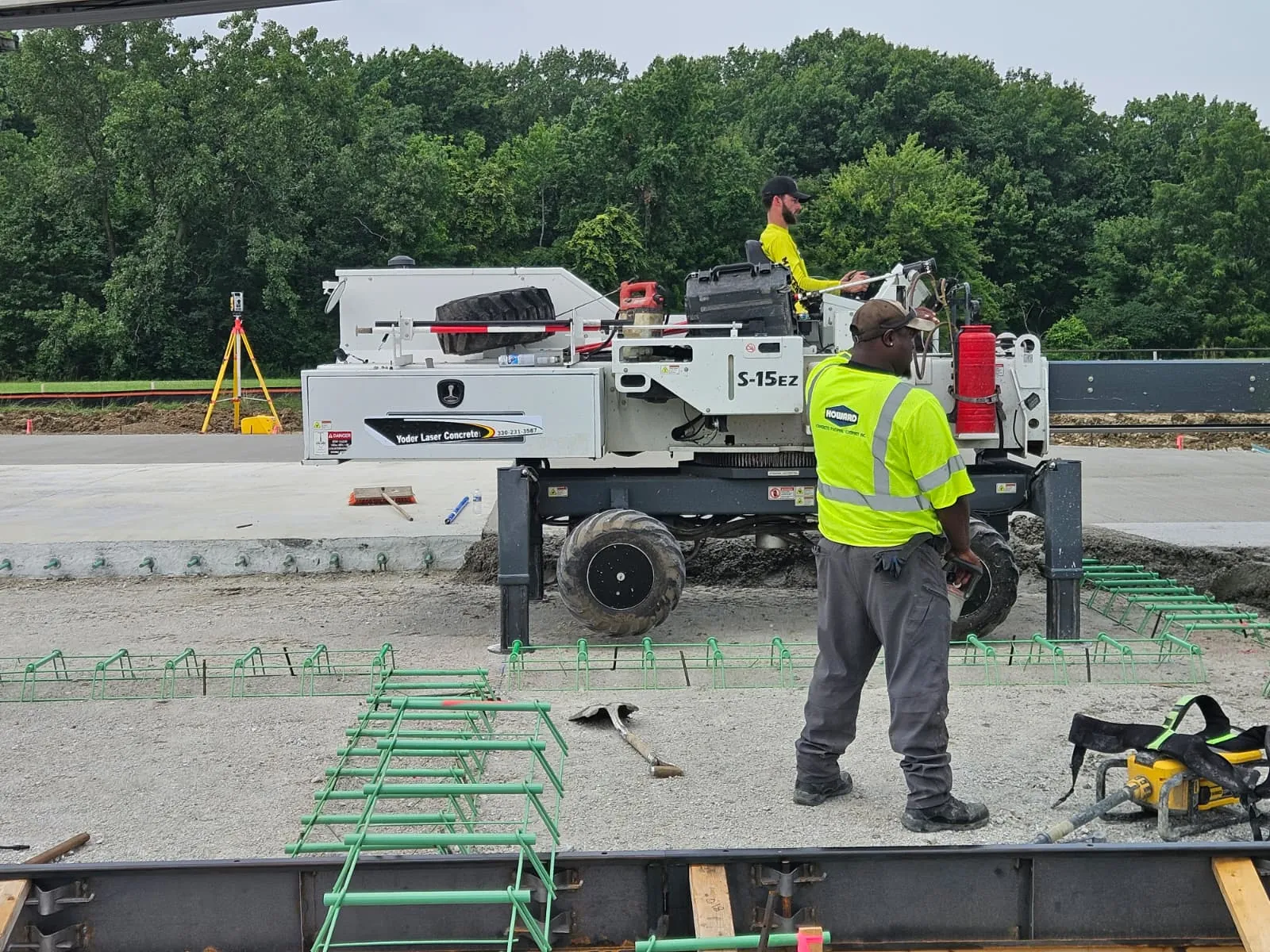 Somero S-15EZ operator and ground crew beside slab reinforcement